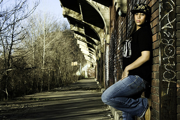 Urban fashion photography of woman in blue jeans with black shirt