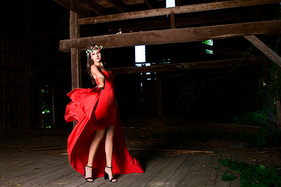 Fashion photography of woman in red dress and floral headpiece