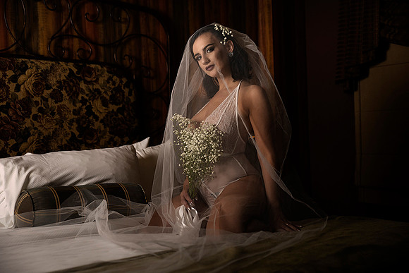 Bridal boudoir photography of woman in veil and teddy